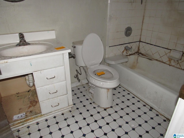 2324 Pentland Dr, Birmingham, AL 35235 - bathroom featuring toilet, tile patterned floors, vanity, washtub / shower combination, and baseboards