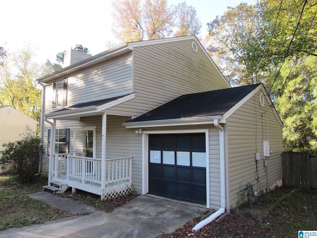 view of front facade with a porch and a garage