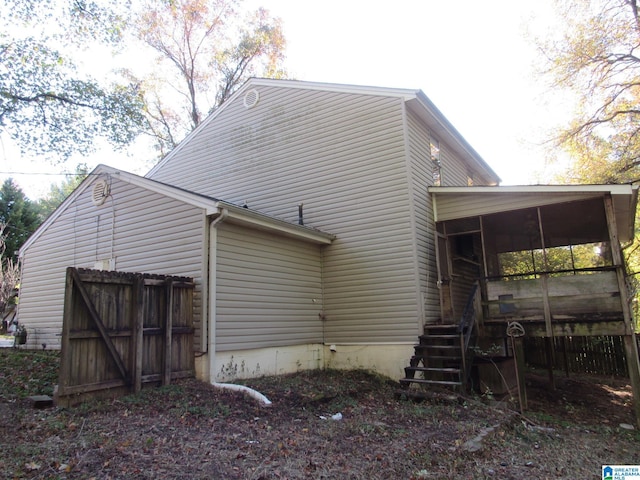 2324 Pentland Dr, Birmingham, AL 35235 - back of house with a sunroom and stairway