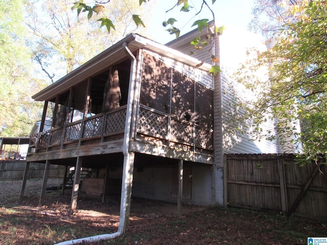 2324 Pentland Dr, Birmingham, AL 35235 - rear view of property featuring a wooden deck and a sunroom