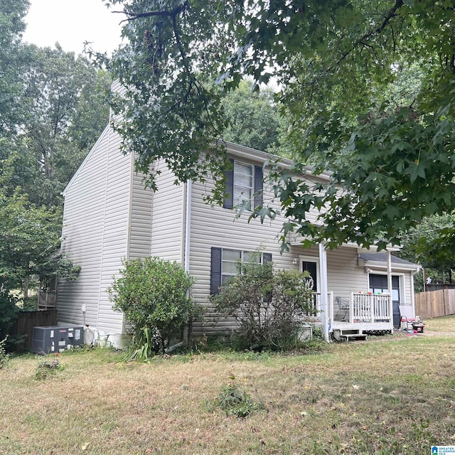2324 Pentland Dr, Birmingham, AL 35235 - view of property hidden behind natural elements featuring central air condition unit and a deck