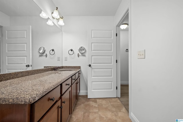 bathroom with tile patterned floors and vanity