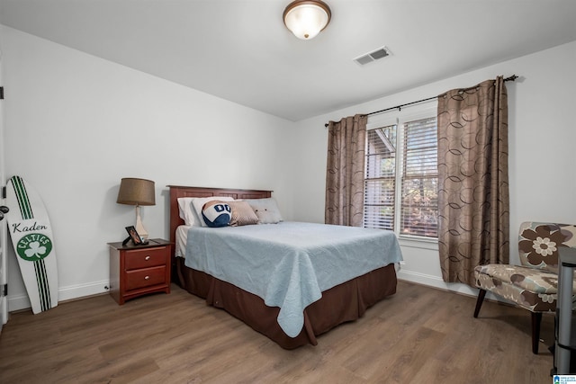 bedroom featuring dark wood-type flooring