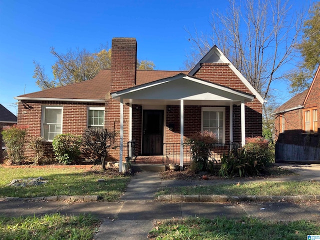 view of front of property featuring covered porch