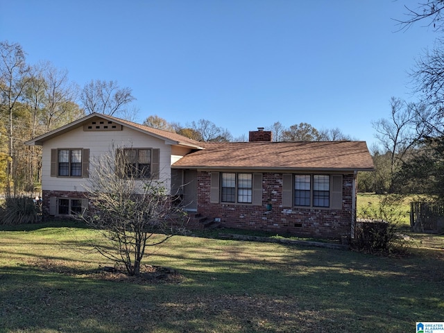 tri-level home featuring a front yard