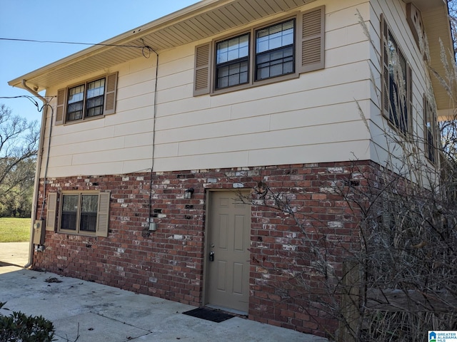 view of side of property featuring a patio area