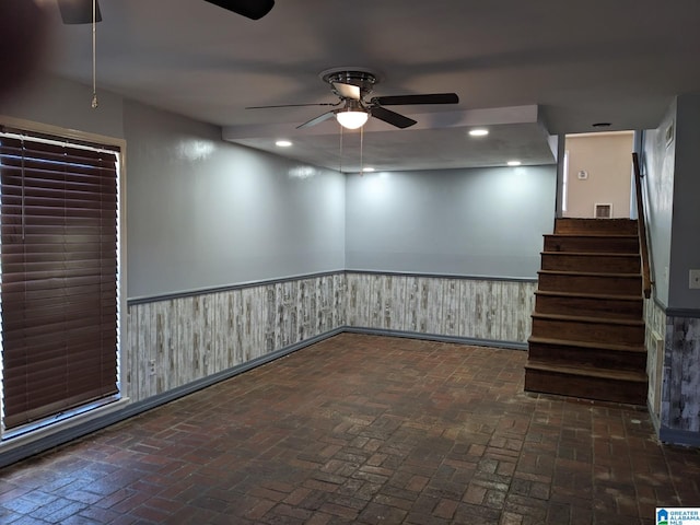 basement with ceiling fan