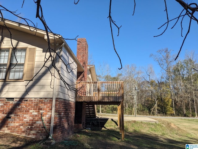 view of side of home with a deck