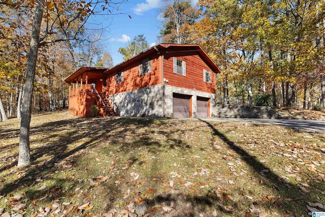 view of property exterior with a garage