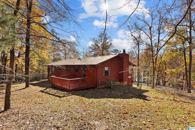 rear view of house with a wooden deck