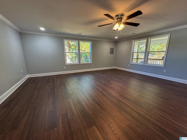 empty room with ceiling fan, dark hardwood / wood-style flooring, and crown molding