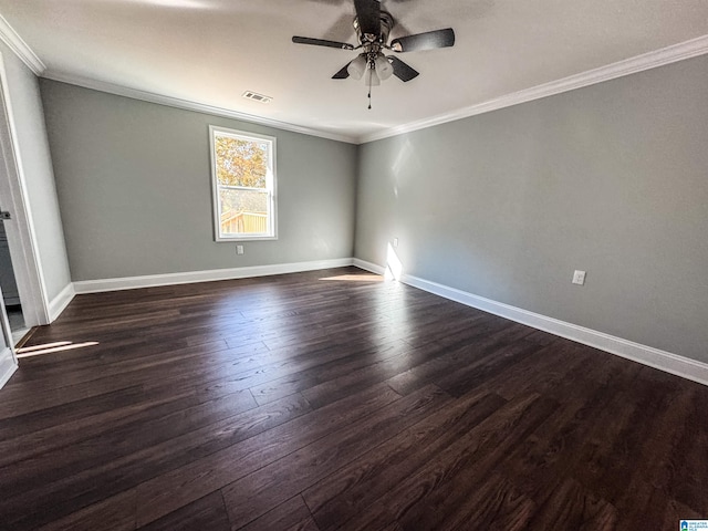 spare room with dark hardwood / wood-style flooring, ceiling fan, and crown molding