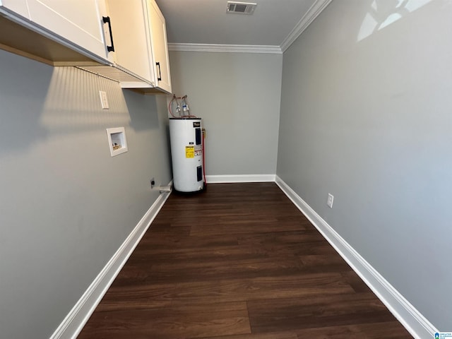 clothes washing area featuring water heater, hookup for a washing machine, cabinets, and dark wood-type flooring