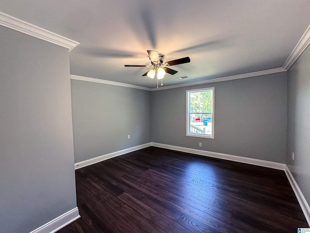 spare room with ceiling fan, dark hardwood / wood-style flooring, and ornamental molding