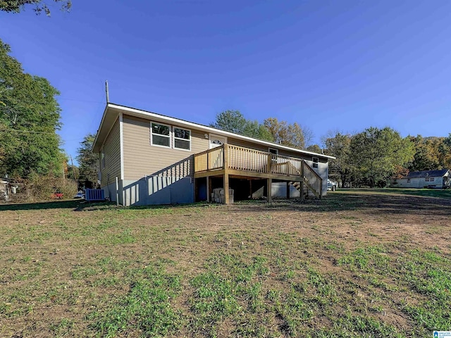 exterior space featuring central AC, a front lawn, and a deck