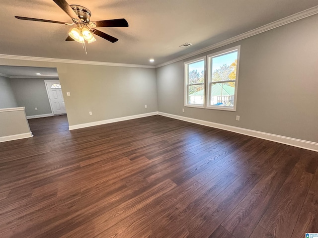 spare room featuring ceiling fan, crown molding, and dark hardwood / wood-style floors