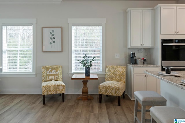 sitting room with light hardwood / wood-style floors