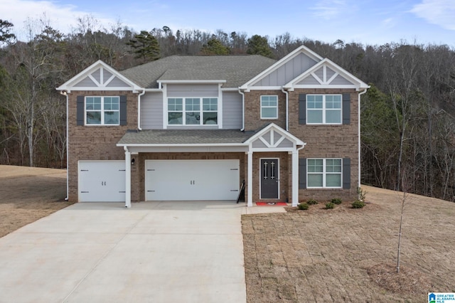 craftsman-style house with a front yard and a garage