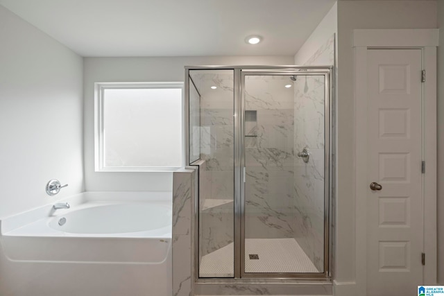 bathroom featuring plus walk in shower