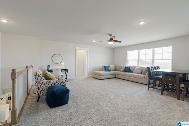 carpeted living room featuring ceiling fan