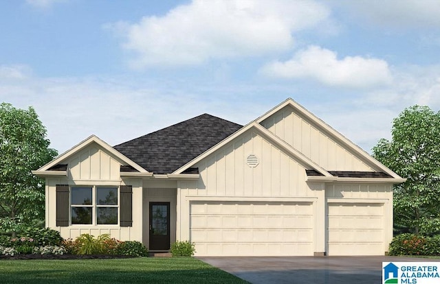 view of front of home with a garage and a front yard