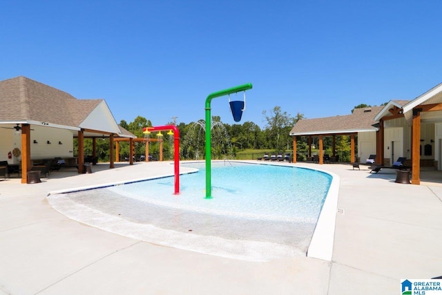 view of swimming pool featuring a patio area