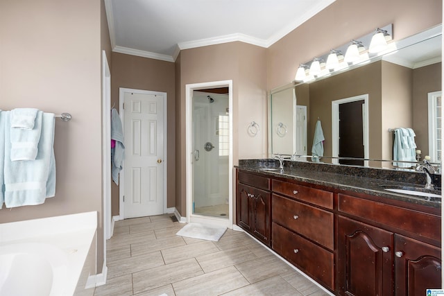 bathroom with vanity, independent shower and bath, and crown molding