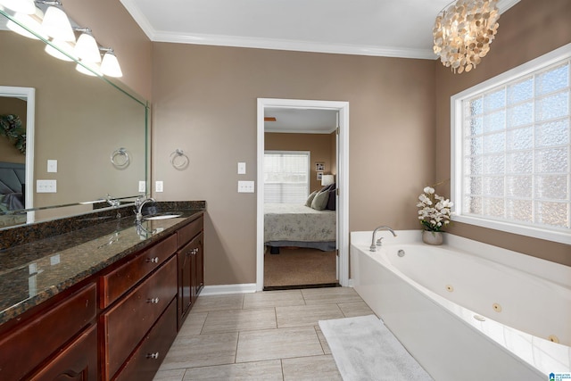 bathroom featuring a tub, vanity, a chandelier, and ornamental molding