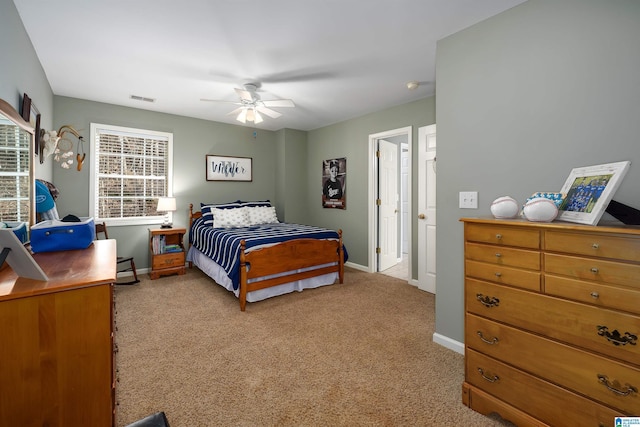 bedroom featuring ceiling fan and light carpet