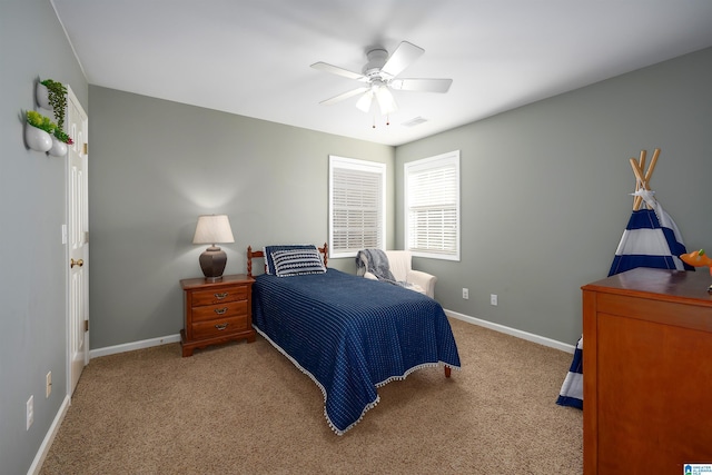 bedroom with ceiling fan and light colored carpet