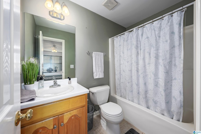 full bathroom with ceiling fan, shower / bath combo, tile patterned floors, toilet, and vanity