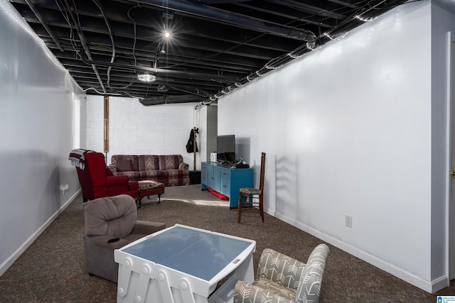 basement with dark carpet