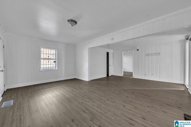 unfurnished room with dark hardwood / wood-style floors