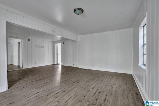 empty room with wood-type flooring