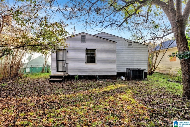 rear view of property featuring central AC unit