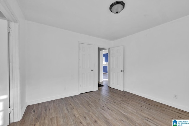 unfurnished room with light hardwood / wood-style flooring