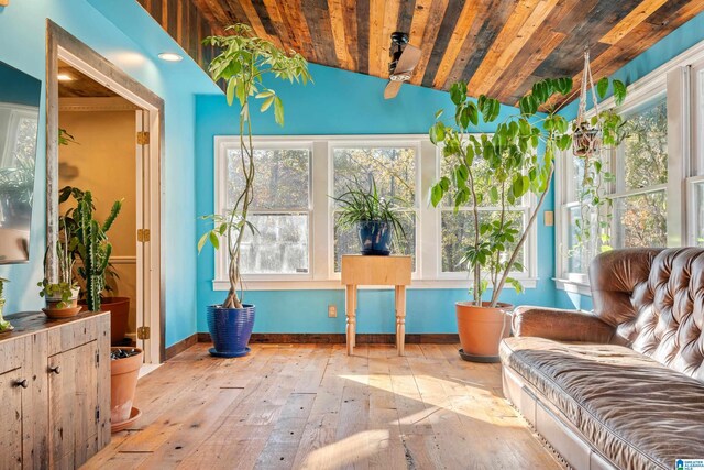 sunroom / solarium featuring wood ceiling and vaulted ceiling