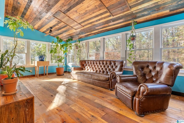 sunroom featuring wooden ceiling and vaulted ceiling