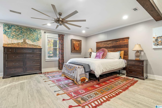 bedroom featuring beam ceiling, ceiling fan, crown molding, and light wood-type flooring