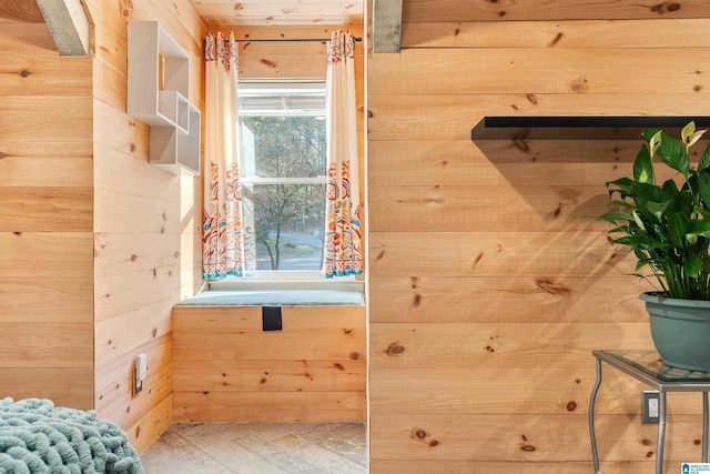 bathroom featuring hardwood / wood-style flooring and wood walls