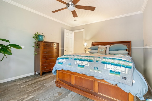 bedroom featuring ceiling fan, wood-type flooring, and ornamental molding