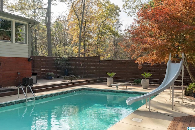 view of pool featuring a water slide