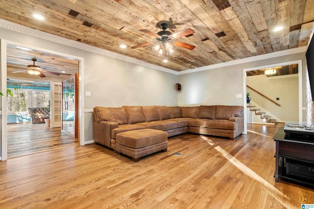 living room featuring ceiling fan, wood ceiling, ornamental molding, and light hardwood / wood-style flooring