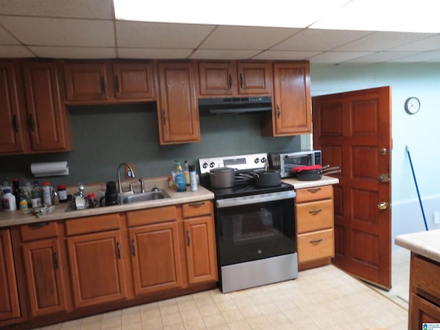 kitchen featuring a paneled ceiling, stainless steel appliances, and sink