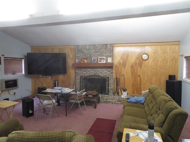 living room featuring carpet flooring, a brick fireplace, lofted ceiling, and wood walls