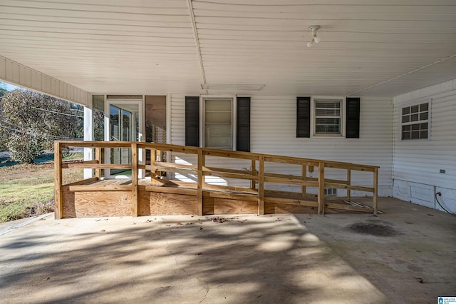 wooden terrace featuring a patio area