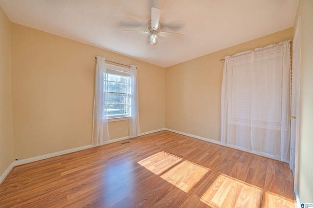 unfurnished room featuring ceiling fan and light hardwood / wood-style flooring