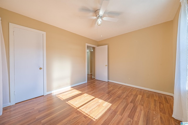 unfurnished bedroom featuring light hardwood / wood-style floors and ceiling fan