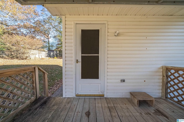 entrance to property featuring a wooden deck