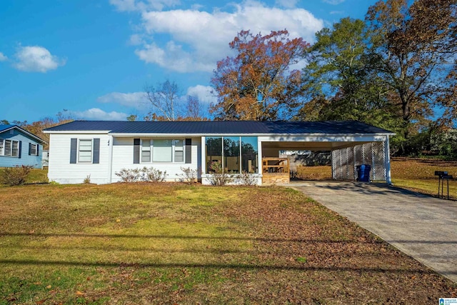 single story home with a front lawn and a carport